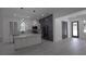 Stylish kitchen featuring an island, modern lighting, stainless steel appliances, and abundant cabinet space at 7011 N 15Th St, Tampa, FL 33610