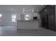 Bright, open kitchen featuring an island, stainless steel appliances, and plenty of cabinet space at 7011 N 15Th St, Tampa, FL 33610