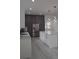 Modern kitchen features a large island, stainless steel appliances, and grey cabinets at 7011 N 15Th St, Tampa, FL 33610