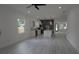 Bright, open-concept living room with stainless steel appliances and a kitchen island, perfect for entertaining at 7011 N 15Th St, Tampa, FL 33610