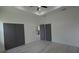 Bright main bedroom featuring multiple closets and views into the kitchen at 7011 N 15Th St, Tampa, FL 33610