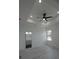 Spacious main bedroom with a tray ceiling, recessed lighting, and access to the bathroom at 7011 N 15Th St, Tampa, FL 33610