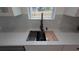 Stainless steel sink with modern faucet and quartz counters at 7011 N 15Th St, Tampa, FL 33610