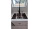 Stainless steel sink with modern faucet under a window at 7011 N 15Th St, Tampa, FL 33610