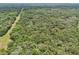 A home situated between expansive woodlands at 7189 Griffin Rd, Brooksville, FL 34601