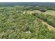 House with trees, surrounded by dense trees and vegetation at 7189 Griffin Rd, Brooksville, FL 34601