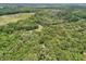 House nestled between an expansive forested area at 7189 Griffin Rd, Brooksville, FL 34601