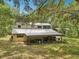 Spacious backyard featuring a large covered storage area, perfect for equipment at 7189 Griffin Rd, Brooksville, FL 34601