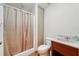 Bathroom with shower and tub combination, toilet, and single sink vanity at 7189 Griffin Rd, Brooksville, FL 34601