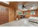 Spacious bonus room with pegboard walls and ceiling fan at 7189 Griffin Rd, Brooksville, FL 34601