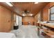 Spacious bonus room with multiple entry doors and ceiling fan at 7189 Griffin Rd, Brooksville, FL 34601