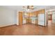 Kitchen with tile floor, wooden cabinets, and white appliances, including a refrigerator and stove at 7189 Griffin Rd, Brooksville, FL 34601