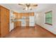 Bright eat-in kitchen features wood cabinets, white appliances, and tile flooring at 7189 Griffin Rd, Brooksville, FL 34601