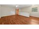 Bright living room with wood-look flooring, ceiling fan, and large closet is spacious and comfortable at 7189 Griffin Rd, Brooksville, FL 34601