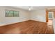 This inviting living room features wood-look floors and a large window, creating a bright and open space at 7189 Griffin Rd, Brooksville, FL 34601