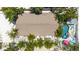 Bird's-eye view of home showing its sprawling backyard, pool, and outdoor dining at 722 Gulf Blvd, Indian Rocks Beach, FL 33785