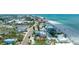 Picturesque aerial view showcasing a beachfront property close to the ocean at 722 Gulf Blvd, Indian Rocks Beach, FL 33785