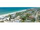 Scenic aerial view showcasing the community and the pristine beach at 722 Gulf Blvd, Indian Rocks Beach, FL 33785