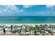 Stunning aerial view of a beachfront property with direct access to the ocean at 722 Gulf Blvd, Indian Rocks Beach, FL 33785