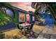 Charming backyard with outdoor seating areas and lush tropical landscaping at 722 Gulf Blvd, Indian Rocks Beach, FL 33785