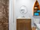 Charming bathroom features a vanity with a white countertop, tile shower, and boat shelf at 722 Gulf Blvd, Indian Rocks Beach, FL 33785