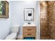 Bathroom featuring a tiled shower, modern vanity, and neutral wall color at 722 Gulf Blvd, Indian Rocks Beach, FL 33785