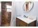 The bathroom showcases a tiled shower, vanity with mirror, and neutral color palette at 722 Gulf Blvd, Indian Rocks Beach, FL 33785