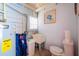 Utility bathroom area with toilet, sink, and storage at 722 Gulf Blvd, Indian Rocks Beach, FL 33785