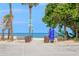 Convenient beach access with benches and informational signage for a relaxing day by the ocean at 722 Gulf Blvd, Indian Rocks Beach, FL 33785