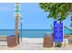 Beach entrance sign with posted regulations and a picturesque view of the ocean at 722 Gulf Blvd, Indian Rocks Beach, FL 33785