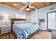 Well-lit bedroom with wood ceiling and trim, and beachy decor at 722 Gulf Blvd, Indian Rocks Beach, FL 33785