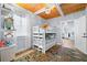 Bright bedroom features a bunk bed and a fish-themed rug, creating a fun atmosphere at 722 Gulf Blvd, Indian Rocks Beach, FL 33785