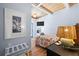 Coastal bedroom featuring a decorative lamp, wooden ceiling, and a blue starfish painting at 722 Gulf Blvd, Indian Rocks Beach, FL 33785