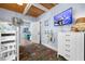 A coastal bedroom includes bunk beds, a TV, and adjacent living space access at 722 Gulf Blvd, Indian Rocks Beach, FL 33785