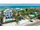 Beautiful beachfront home with private pool and tropical landscaping near the turquoise water at 722 Gulf Blvd, Indian Rocks Beach, FL 33785