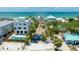 Charming beachfront house with a private pool and lush tropical landscaping near the ocean at 722 Gulf Blvd, Indian Rocks Beach, FL 33785