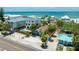 Desirable beachfront property featuring a private pool and lush tropical foliage with neighborhood views at 722 Gulf Blvd, Indian Rocks Beach, FL 33785