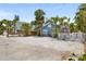 Charming blue beach house with a white picket fence and lush tropical landscaping at 722 Gulf Blvd, Indian Rocks Beach, FL 33785