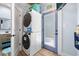 This laundry area features a stacked washer/dryer combo at 722 Gulf Blvd, Indian Rocks Beach, FL 33785