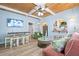 Cozy living room featuring a coffered ceiling, comfortable seating, and an open floor plan at 722 Gulf Blvd, Indian Rocks Beach, FL 33785