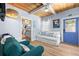 Relaxing living room area, with beach-themed decor, wood ceilings, and an airy feel at 722 Gulf Blvd, Indian Rocks Beach, FL 33785