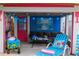 Covered patio with outdoor seating and colorful decor creates a fun and inviting space for relaxation and entertainment at 722 Gulf Blvd, Indian Rocks Beach, FL 33785