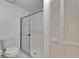 Bright bathroom with a glass-enclosed shower and tiled walls at 746 Masterpiece Dr, Sun City Center, FL 33573