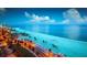 Stunning beach view with clear water, palm trees, and blue skies, perfect for relaxation at 746 Masterpiece Dr, Sun City Center, FL 33573