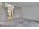 Spacious carpeted bedroom featuring a ceiling fan and bathroom access at 746 Masterpiece Dr, Sun City Center, FL 33573