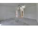 Large bedroom with ceiling fan, carpet floors, and access to a closet or bathroom at 746 Masterpiece Dr, Sun City Center, FL 33573