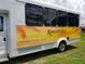 Community shuttle bus with 'Kings Point' branding parked outside, highlighting transportation services at 746 Masterpiece Dr, Sun City Center, FL 33573