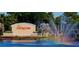 Picturesque entrance sign for Sun City Center with a fountain, showcasing community's welcoming ambiance at 746 Masterpiece Dr, Sun City Center, FL 33573