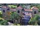 A grand entrance to a community featuring manicured landscaping and an ornate gatehouse at 746 Masterpiece Dr, Sun City Center, FL 33573