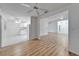 Open-concept living space featuring vaulted ceilings, tile and wood-look floors, connecting to the kitchen at 746 Masterpiece Dr, Sun City Center, FL 33573